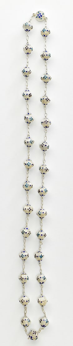 STERLING SILVER ROSARY FILIGREE BEADED NECKLACE: A rosary filigree beaded necklace adorned with inlaid enamel. The stone is marked "Silver" on the clasp and was professionally tested positive for silver. The necklace weighs 35.2 grams and has a leng
