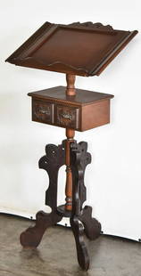 VICTORIAN EASTLAKE WALNUT AND OAK LECTERN PODIUM: A Victorian Eastlake walnut and oak lectern podium, circa turn of the 19th century. The lectern measures 43" H x 21" W x 13" D.
