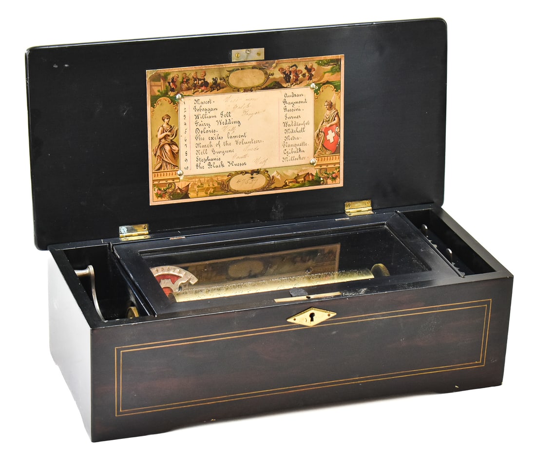 19TH C. PAILLARD SWISS CYLINDER MUSIC BOX: A circa 1885 Paillard Swiss made in Sainte Croix cylinder music box with an 8.75" cylinder. Plays ten airs and is numbered 54553. Measures 6" H x 18" W x 8.25" D.
