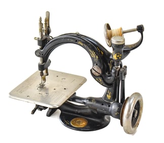 B. ELDREDGE AND WILCOX & GIBBS CAST IRON AUTOMATIC TOY SEWING MACHINE NO. A452689