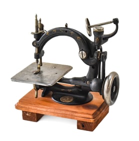 B. ELDREDGE AND WILLCOX & GIBBS CAST IRON AUTOMATIC TOY SEWING MACHINE NO. 28211