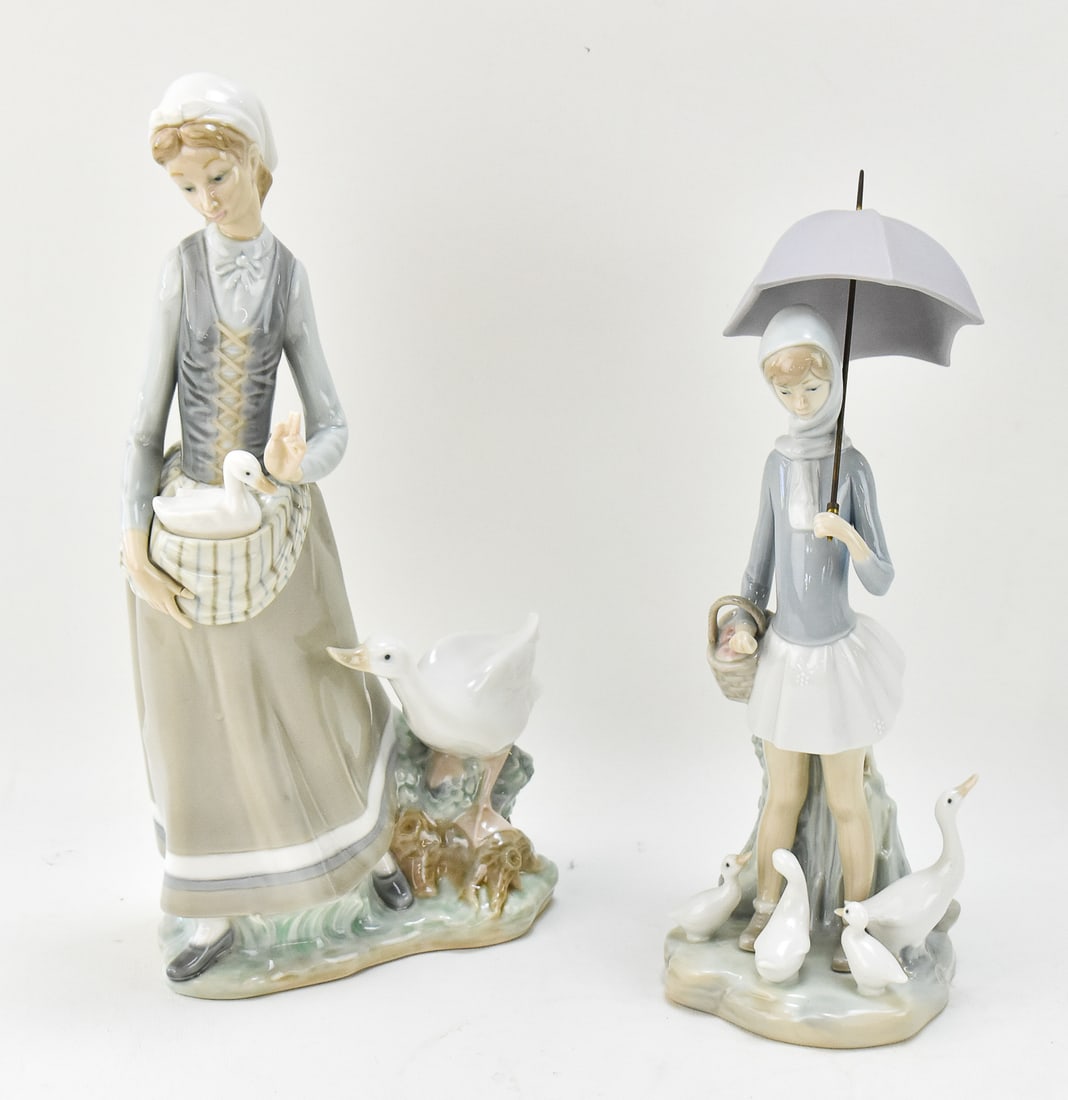 LLADRO 'GIRL WITH GOOSE' AND 'GIRL WITH UMBRELLA AND GEESE' PORCELAIN FIGURINES: This lot includes a Lladro "En el Corral - Girl with Goose" No. 4815 porcelain figurine (12.5" tall, 7" wide, and 3" deep) made by Vincente Martinez circa 1972-1991 and a Lladro "Nina con Paraquas y P