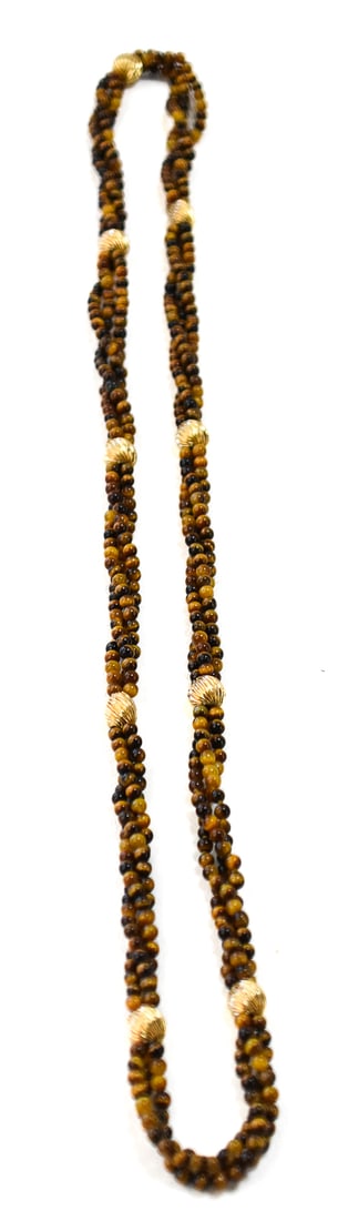 VINTAGE TIGER EYE AND 14K GOLD BEADED NECKLACE: A tiger eye beaded 14 karat gold necklace, circa late 20th century. The necklace measures 32" long and the total weight is 53.60 grams.