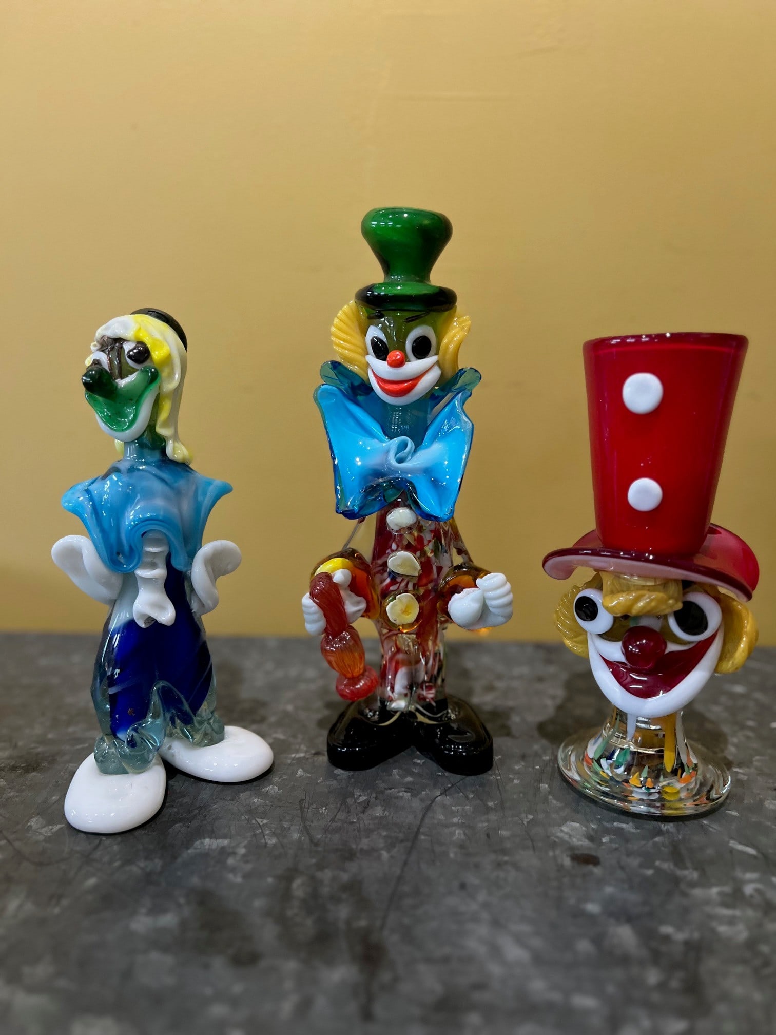 MURANO ART GLASS CLOWNS: Three Murano art glass of Italy clown figurines, the tallest of which measures 10 inches in height.