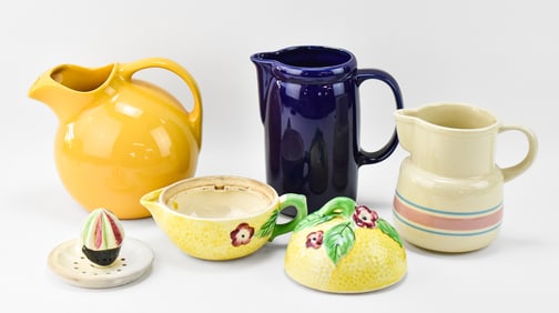 VINTAGE COLLECTION OF CERAMIC DRINKWARE: JAPAN-MADE LEMON JUICER, MCCOY PITCHERS, AND HALL YELLOW