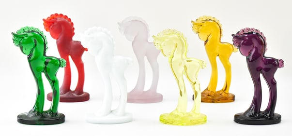 COLLECTION OF SEVEN MOSSER GLASS TROJAN PONIES