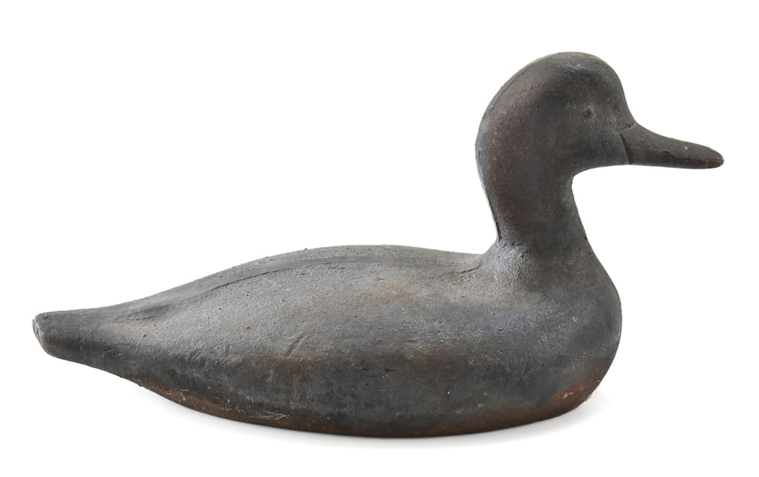 CAST IRON SINK BOX DECOY: A heavy circa 1900 cast iron sink box duck hunting decoy measuring 8" H x 15" W x 7" D.