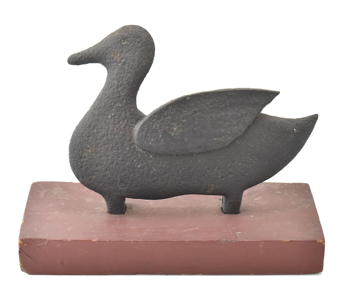 CIRCA 1920s SHOOTING GALLERY CAST IRON DUCK TARGET: A cast iron shooting gallery arcade game duck on a wood base, measuring 0" H x 12" W x 6" D.