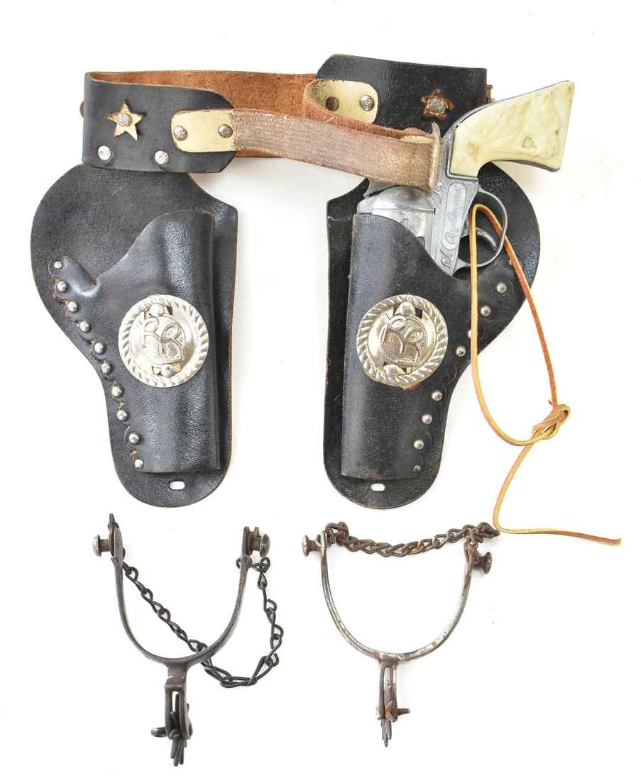 KILGOR ROY ROGERS REVOLVER CAP GUN: A Kilgor Roy Rogers revolver cap gun made in the USA in the late 1950s to early 1960s, with a double holster and spurs.