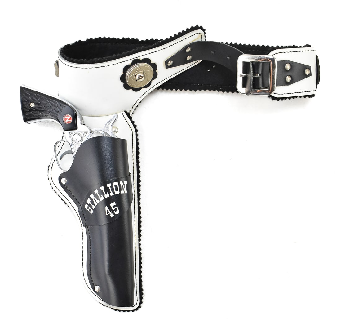 NICHOLS STALLION 45 REVOLVER CAP GUN: A Nichols Stallion 45 revolver cap gun with a matching holster, made in the USA in the late 1950s.