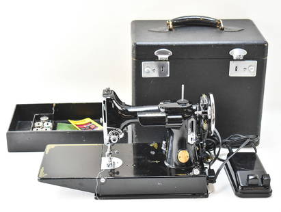 1950S SINGER FEATHERWEIGHT 221-1 SEWING MACHINE: A 1950s Singer Featherweight 221-1 portable electric sewing machine serial #AF080253 with the original carrying box.