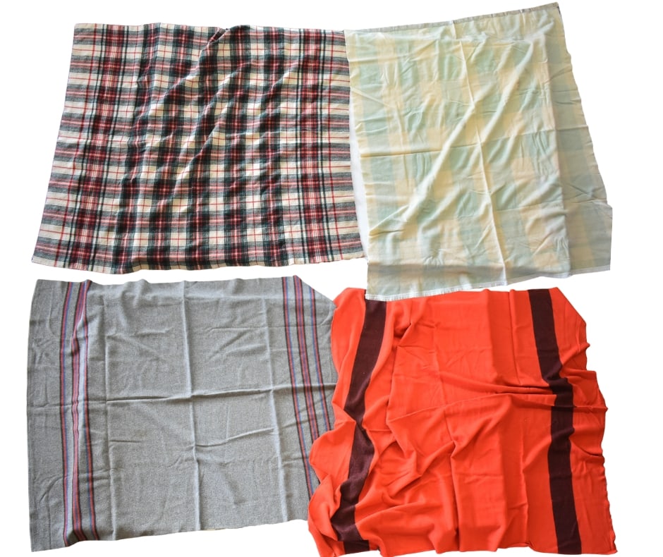 VINTAGE WOOL & COTTON THROW BLANKETS: Four vintage throw blankets, one Pendleton-style blanket in grey wool, one in red cotton or wool twine, and a plaid and ivory blanket.