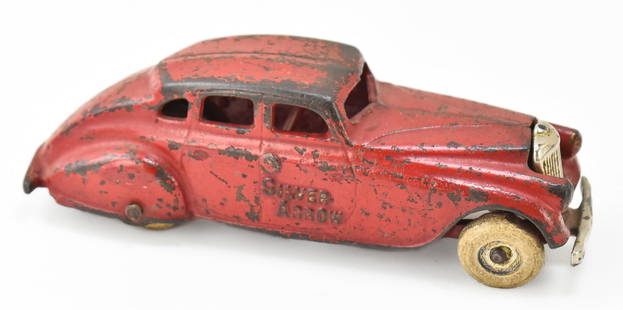 ARCADE SILVER ARROW CAST IRON SEDAN TOY: An Arcade Silver Arrow cast iron sedan toy marked "166", circa 1930s. The toy measures 2.5" heigh, 7" wide, and 2" deep.