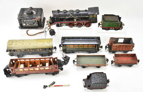 MARKLIN GERMAN ELECTRIC TRAIN SET: A vintage Marklin of Germany electric train set with a transformer, cars such as the "Schlafenwagen", and a locomotive.