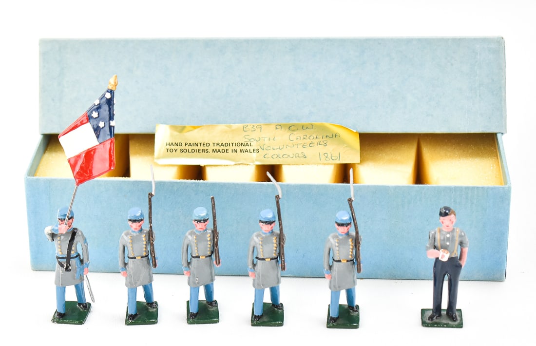 BLENHEIM TOY SOLDIERS: SOUTH CAROLINA VOLUNTEERS AND MORE: This lot includes the following toy soldiers, circa late 19th century: five Traditional/Blenheim South Carolina volunteers, Blenheim soldier drinking designed by Frank Scroby, and a box (2.5" tall, 9.