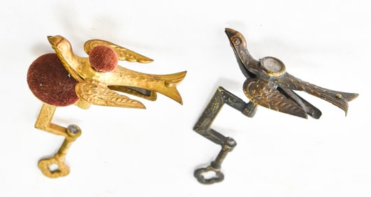 TWO VINTAGE CAST METAL SEWING BIRDS