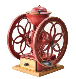 CIRCA 1900 ENTERPRISE COFFEE GRINDER: An Enterprise Manufacturing, Philadelphia, PA cast iron coffee grinder measuring 16" H x 16" W x 10" D, with a patent date of July 12, 1898.