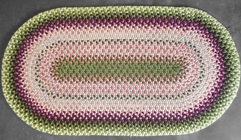 EARLY 20TH CENTURY OVAL BRAIDED RUG