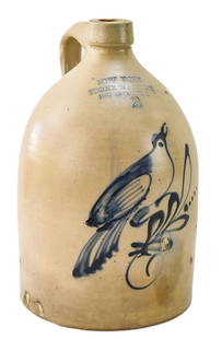 NEW YORK STONEWARE COMPANY 2-GALLON JUG: A New York Stoneware Company 2-gallon jug with cobalt blue slip bird, circa 1859-1885. The item measures 15" H x 8" W x 7" D.
