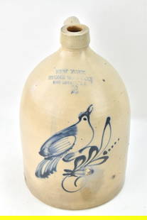 NEW YORK STONEWARE COMPANY 2-GALLON JUG: A New York Stoneware Company 2-gallon jug with cobalt blue slip bird, circa 1859-1885. The item measures 15" H x 8" W x 7" D.