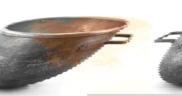 CIRCA 1900 COPPER CANDY KETTLE: A large copper candy kettle pot with iron handles. Measures 11" H x 29" W x 23.5" D.