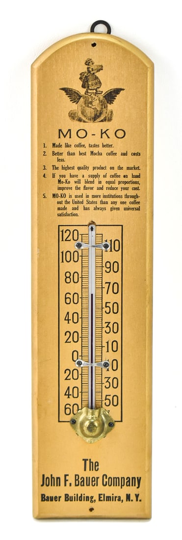 MO-KO STEEL CUT COFFEE ADVERTISEMENT THERMOMETER: A Mo-Ko steel cut coffee wooden advertisement thermometer for The John F. Bauer Company, circa early 20th century. The item measures 12.5" H x 3" W x 1" D.