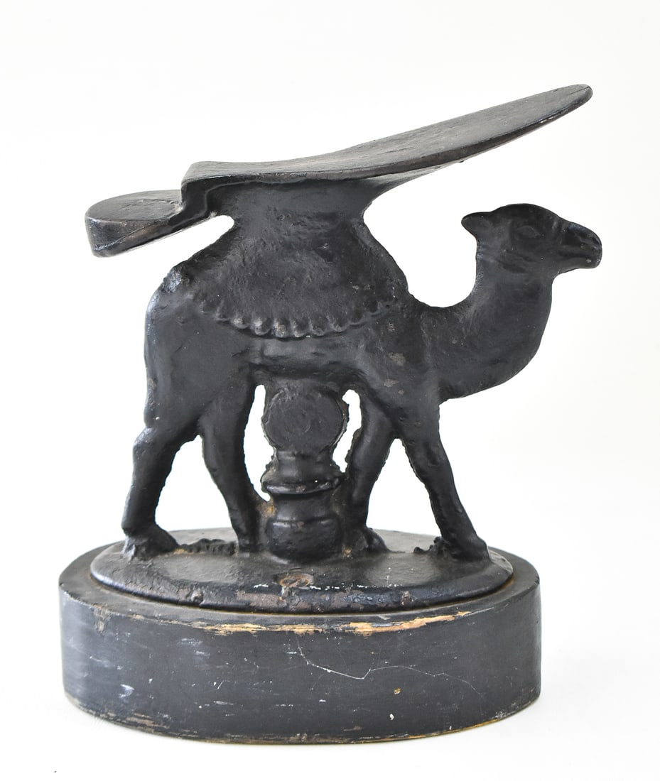 CAST IRON CAMEL SHOE SHINE STAND (1 of 2)