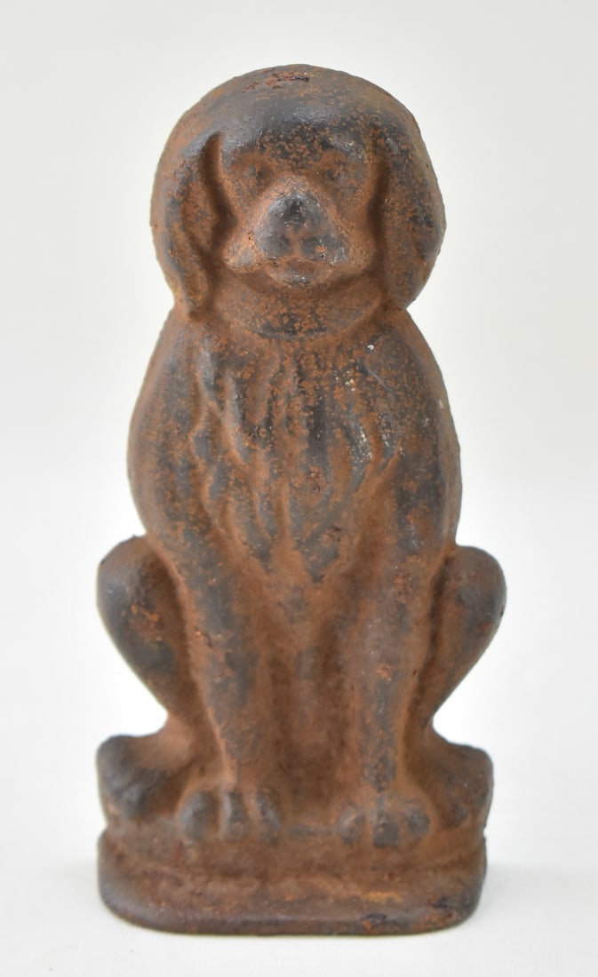 EARLY 20TH CENTURY CAST IRON SPANIEL DOORSTOP: Spaniel dog cast iron doorstop measuring 7" H x 3.5" W x 1.5" D. Circa early 1900s and unmarked.