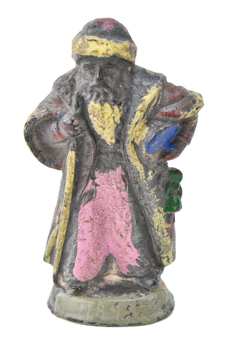 '1895' SANTA CLAUS LEAD-FILLED FIGURINE: A lead-filled Santa Claus figurine dated "1895". The item measures 5" H.