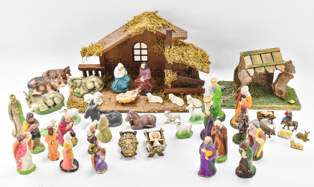 CHRISTMAS NATIVITY MANGERS & FIGURINES: Two Christmas nativity mangers and approximately forty nativity figurines, some marked Japan and Italy. The largest manger measures 10" H x 16" W x 6" D.