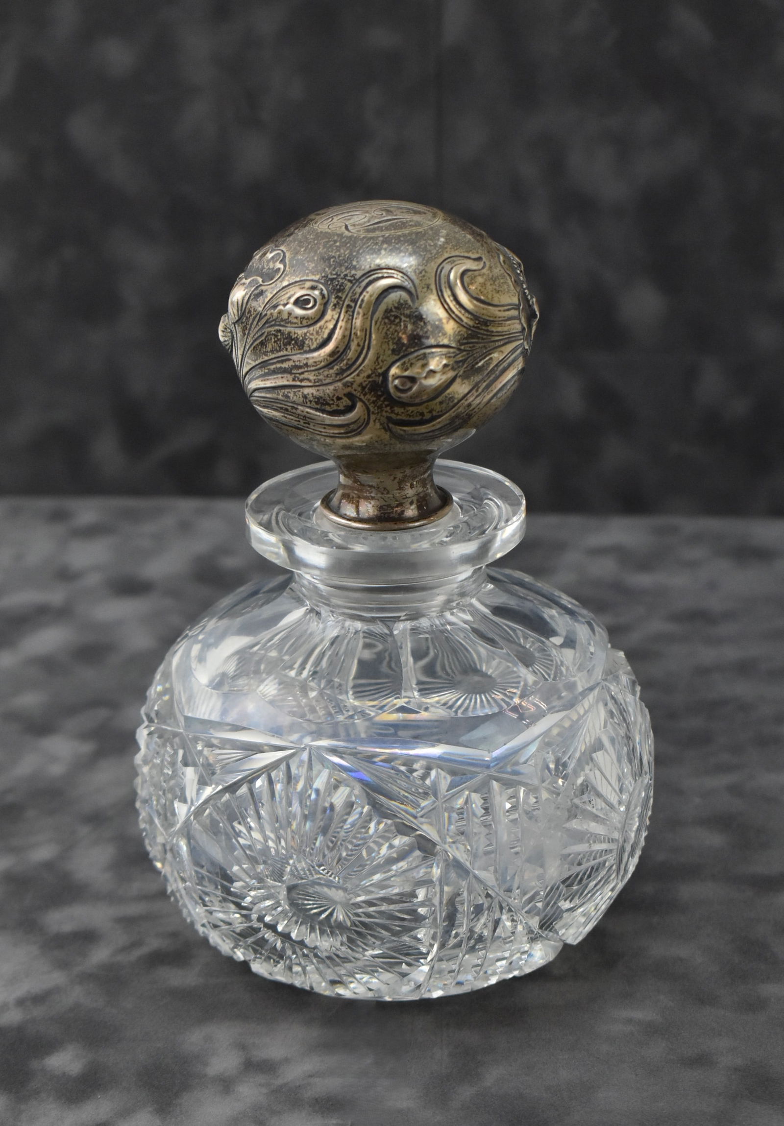 ST. JUDE CHARITY LOT: ANTIQUE CUT-CRYSTAL PERFUME BOTTLE OR DECANTER WITH SILVER STOPPER