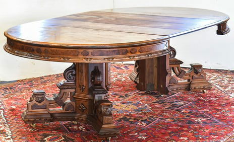 EASTLAKE WALNUT OVAL DINING TABLE; 19TH CENTURY