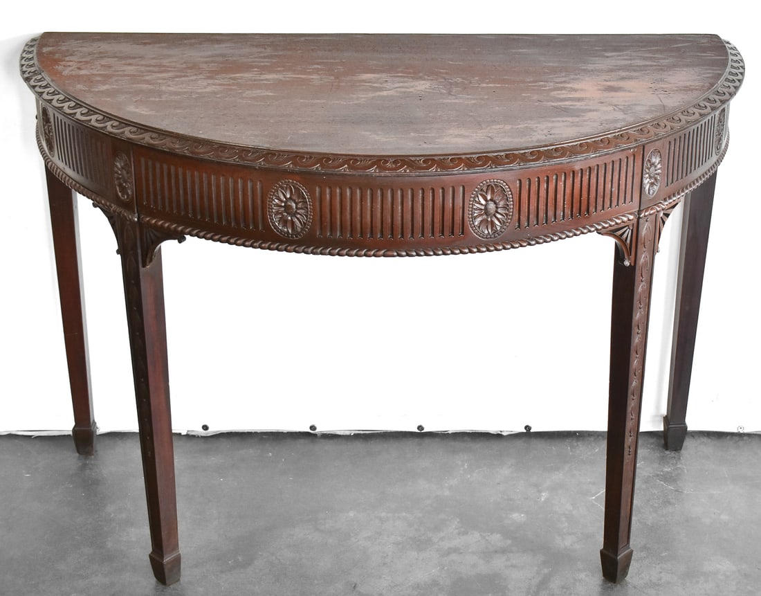 EDWARDIAN STYLE DEMILUNE CONSOLE: An Edwardian style demilune console with tapered legs. The item measures 31" H, 45.5" W, 23" D.