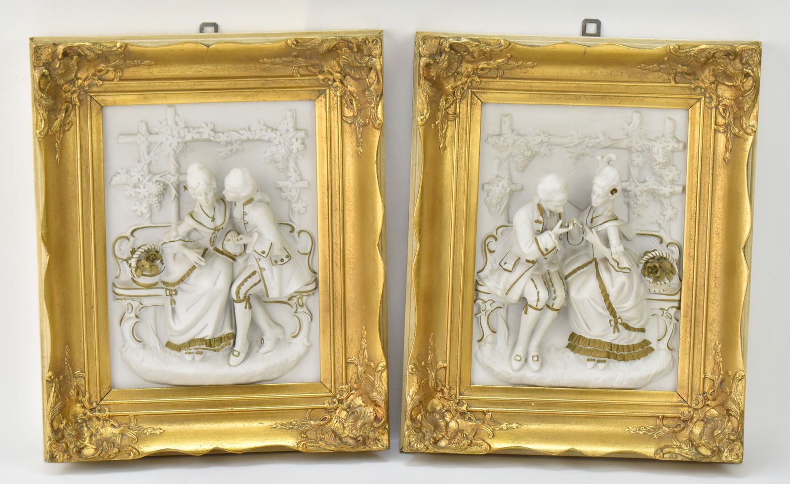 ALT MEISSEN ARTS FRAMED PORCELAIN RELIEF PLAQUES: An Alt Meissen Arts "Scenes from the Castle-Park of Sansoucci about 1750-1760" framed bisque porcelain relief plaques, circa 1940s-50s. Plaques with frame measures 13" H x 10.5" W x 2.5" D.