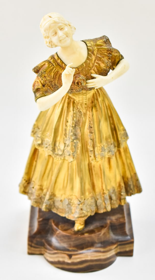 SIGNED PAUL PHILIPPE 'SMILING MAIDEN' GILDED BRONZE FIGURINE: A gilded bronze and de minimis ivory figurine "Smiling Maiden" signed by listed artist, Paul Philippe (FR, 1870-1930). Figurine is mounted on a stone base which is marked "Made in Franc