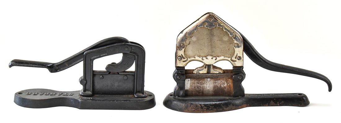 TWO EARLY 1900s CAST IRON TOBACCO CUTTERS: Includes a T.C. Johnson tobacco cutter with pat. date 1914, measuring 9" H x 15" W x 4" D, and a tobacco cutter marked "Standard".