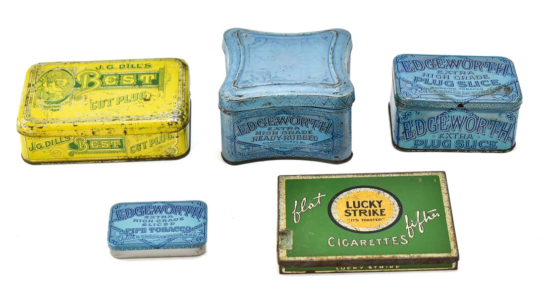 FIVE ANTIQUE TOBACCO & CIGARETTE TINS: Five circa 1920s-30s tobacco and cigarette tins from Edgeworth, J.G. Dill's, and Lucky Strike. The largest tin measures 3" H x 5" W x 5" D.