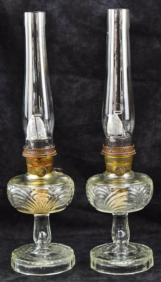 PAIR OF ALADDIN WASHINGTON DRAPE GLASS OIL LAMPS: A pair of Aladdin Washington Drape glass oil lamps with brass hardware, each measuring just over 24" H.
