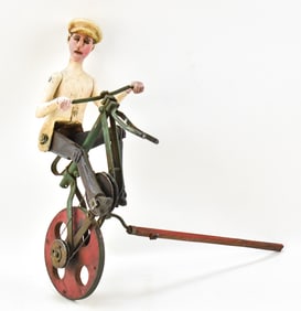 EUROPEAN FOLK ART ARTICULATED MECHANICAL BICYCLE RIDER.