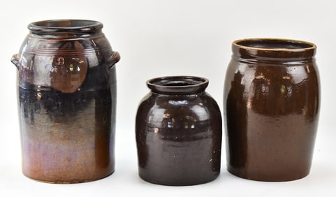 THREE ANTIQUE BROWN-GLAZED STONEWARE CROCKS