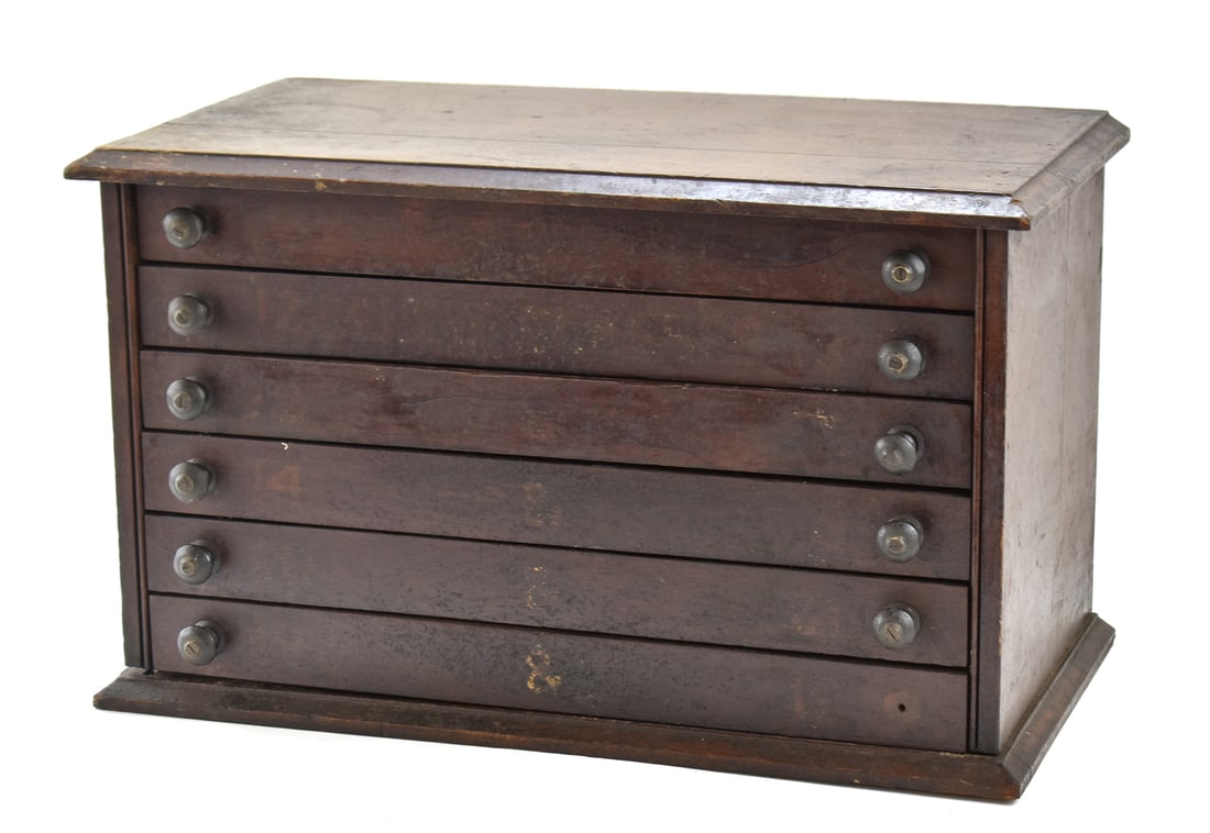 EARLY 1900S SIX-DRAWER SPOOL CABINET: An early 1900s spool cabinet with six drawers, measuring 14" H x 23" W x 12" D.