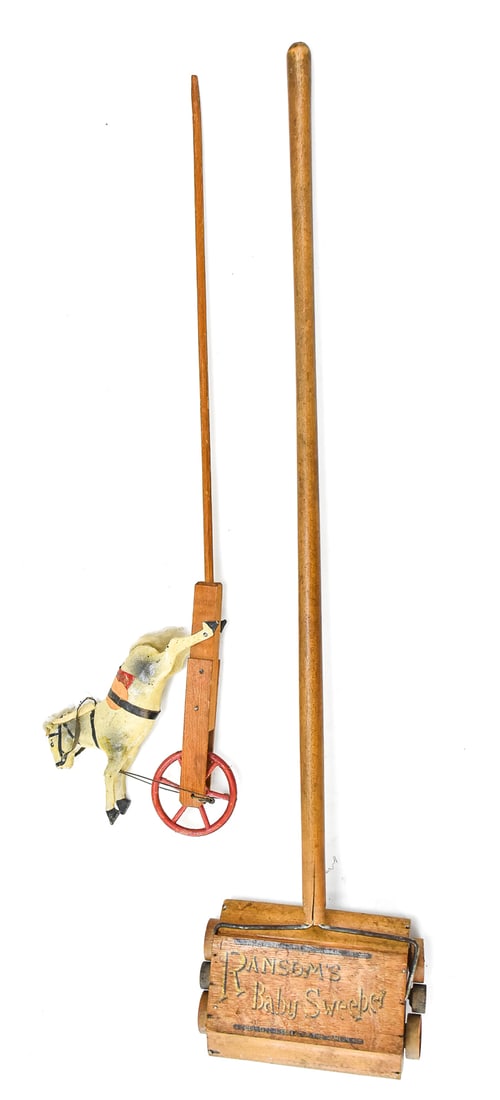 WOODEN HORSE PUSH-TOY & RANSOM'S BABY SWEEPER: An antique wooden painted horse with saddle wheeled push-toy, and a Ransom's "Baby Sweeper" measuring 30" H x 7" W x 5" D.
