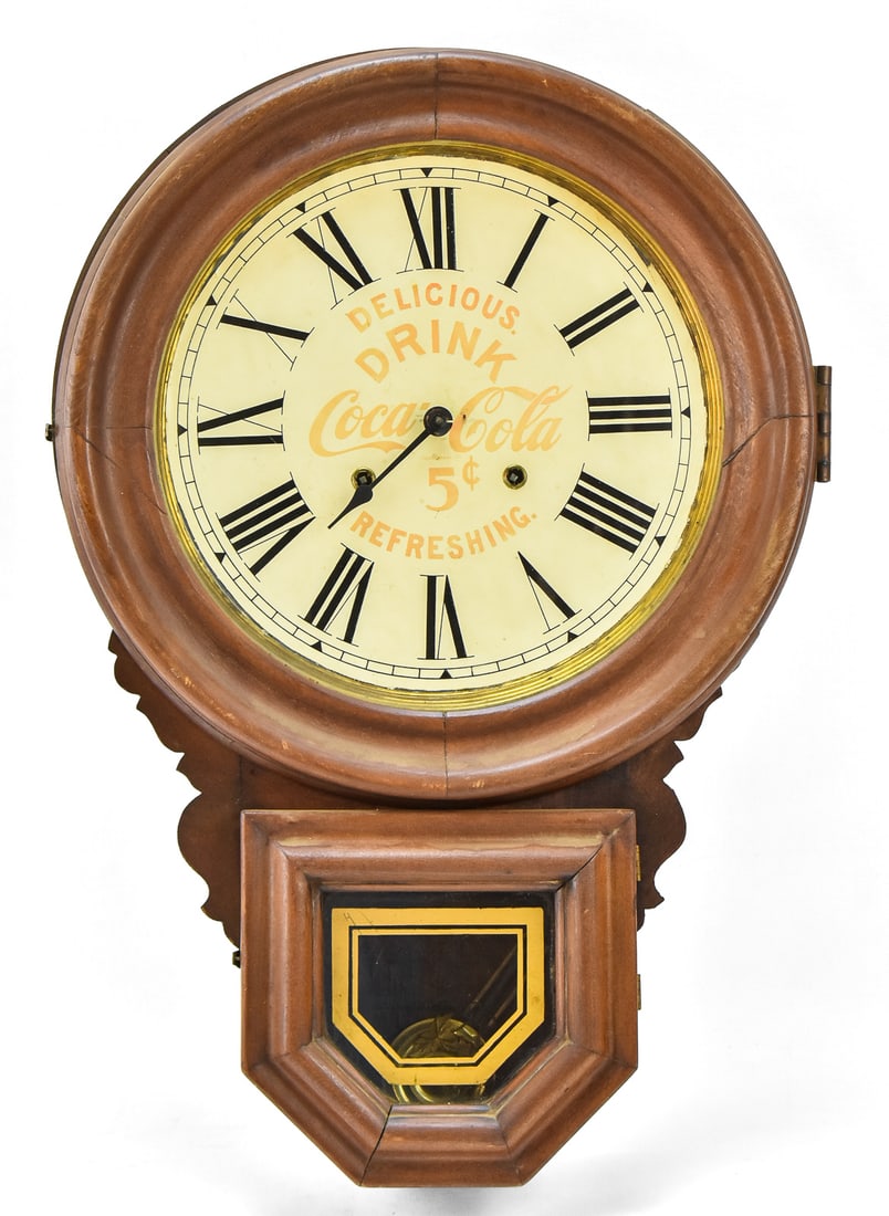 EARLY 20TH C. COCA-COLA ADVERTISING WALL CLOCK: An early 1900s Ingraham Coca-Cola Regulator advertising wall clock, measuring 24" H x 16.5" W x 4" D.