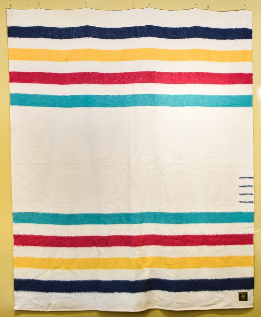 VINTAGE WHITNEY FOUR POINT WOOL BLANKET: A vintage Whitney Point four point wool blanket. The item measures 88.5" H, 71.5" W, 1" D.