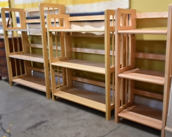 THREE CONTEMPORARY WOODEN FOLDING BOOKCASES
