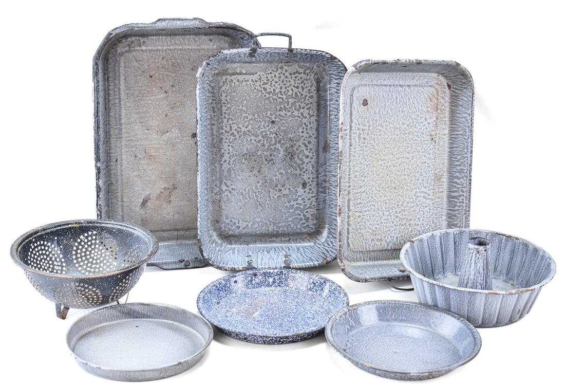 ASSORTED GRANITE ENAMEL COOKWARE: An assortment of granite enamel cookware, including a Jell-o mold, strainer, plates, baking pans, etc. The largest pan measures 16.5" L.