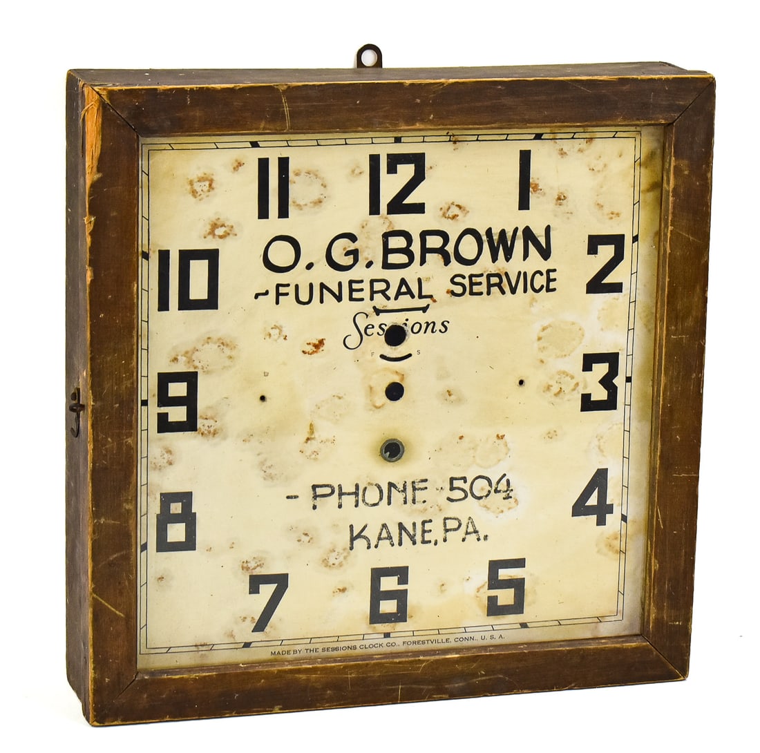 SESSION CLOCK CO. O.G. BROWN FUNERAL SERVICE ADVERTISING WALL CLOCK: An early 1900s Sessions Clock Co. advertising square wall clock for O.G. Brown Funeral Service in Kane, Pennsylvania, measuring 13.25" H x 13.25" W x 3" D.