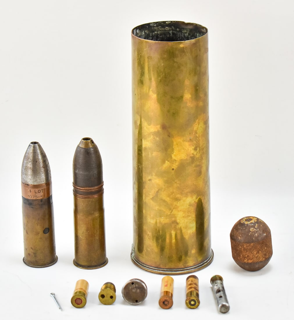 ASSORTED MILITARY CARTRIDGE & SHELL COLLECTIBLES: An assortment of military cartridge and shell collectibles, including: an assortment of inert mortar blanks and inert fuses, an inert Model 1918 37mm gun cannon shell with the projectile, an inert Und