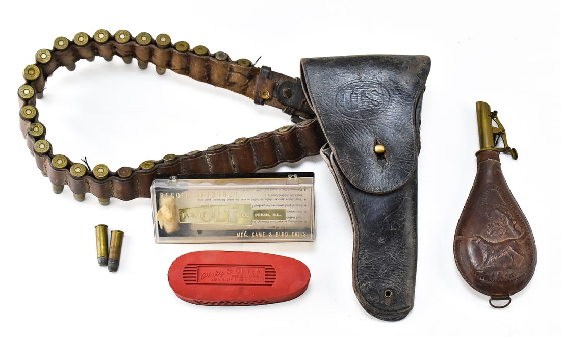 19TH CENTURY AMMO BELT, SHOT FLASK, & MORE: This lot includes: one 19th century leather ammo belt or bandolier with antique .45-70, .44 WCF, etc. cartridges and a reproduction Hunter Co. Union oval embossed leather pistol holster, one antique m