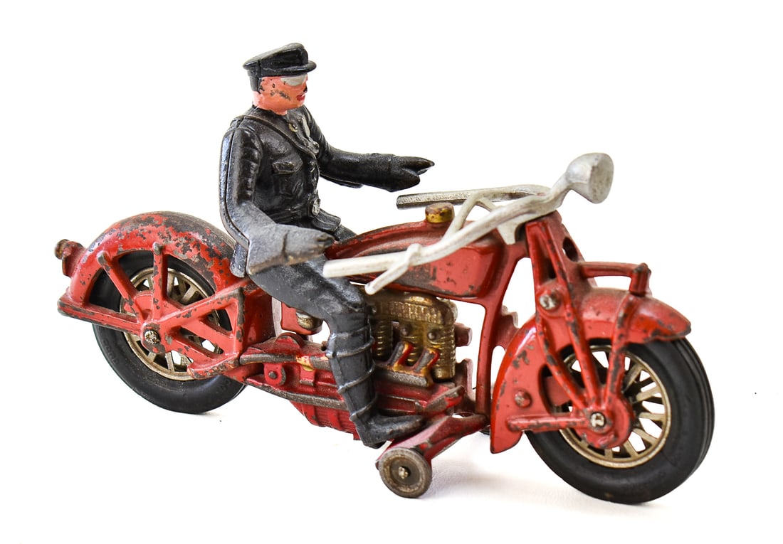 HUBLEY CAST IRON 'COP' ON INDIAN MOTORCYCLE: A Hubley Manufacturing Company cast iron "Cop" with a Hubley marked cast iron Indian motorcycle "1625 BA", circa 1930s. The item measures 5.5" H, 3" W, 9.5" D.